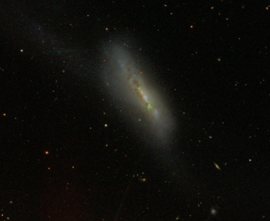 NGC 4747 Galaxy: A Peculiar Dance of Distortion and Starbirth